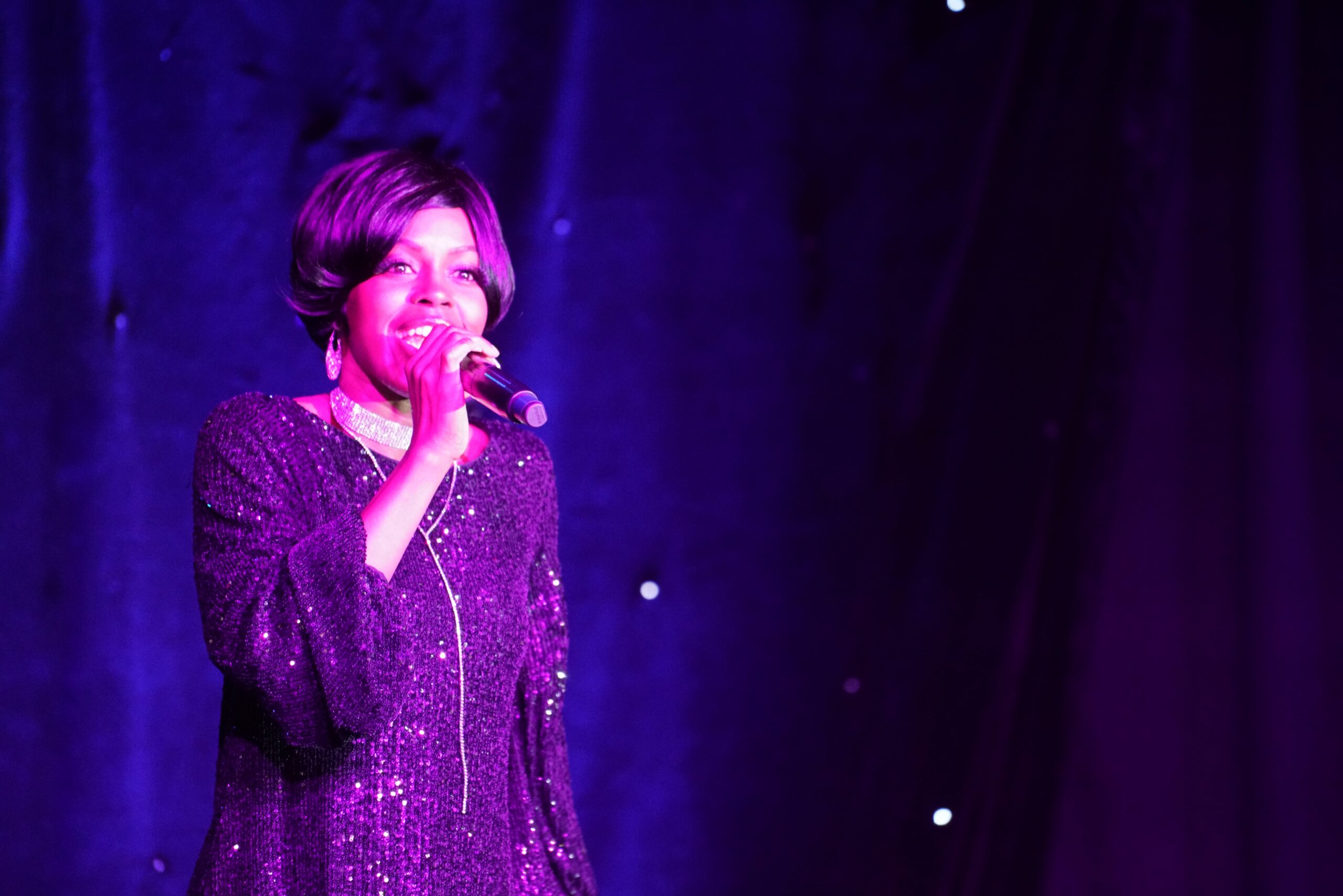Motown Brunch singer in a purple sequin dress performing a Motown classic at The Modern Showrooms, Las Vegas
